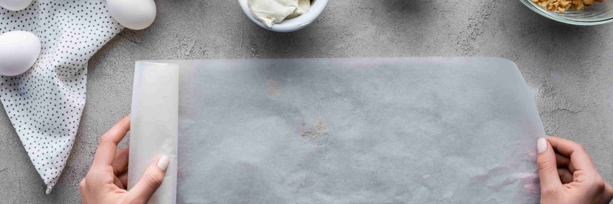 cropped-shot-of-woman-holding-baking-paper-with-ar-2022-12-16-17-41-10-utc-min-scaled